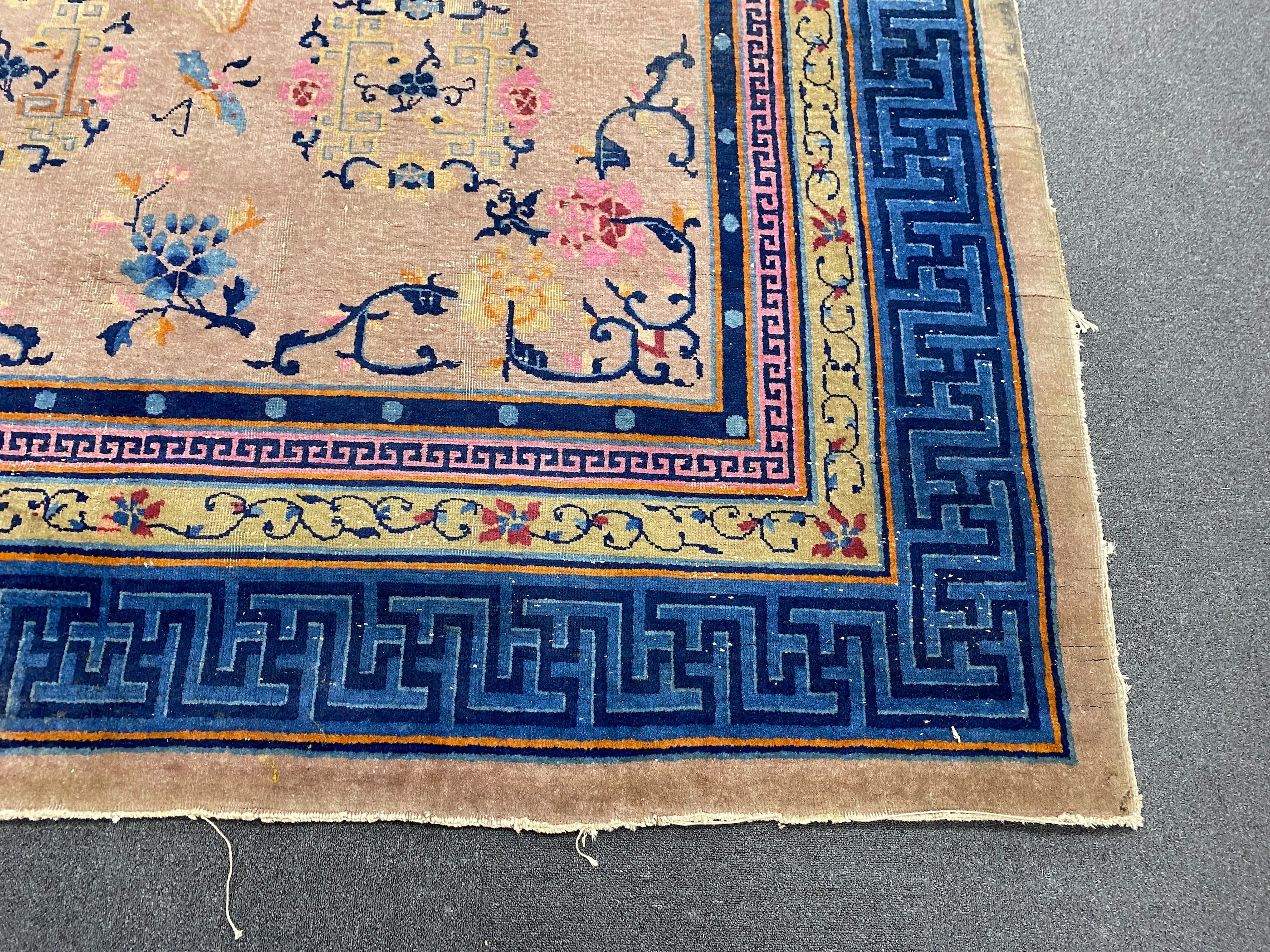 An early 20th century Chinese lilac ground carpet, 330 x 240cm